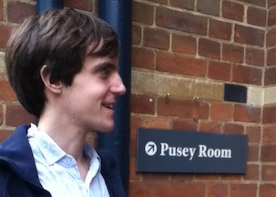 Matt & a sign for the 'Pusey Room'